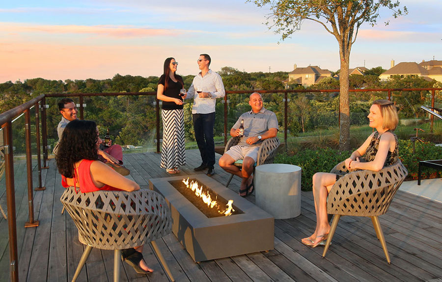 Patio area with fire pit at the Den amenity center Patio area with fire pit at the Den amenity center