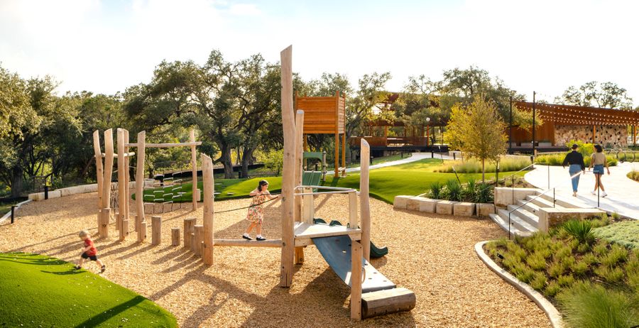 Young child playing on Discovery Playground amenity at Wolf Ranch Young child playing on Discovery Playground amenity at Wolf Ranch