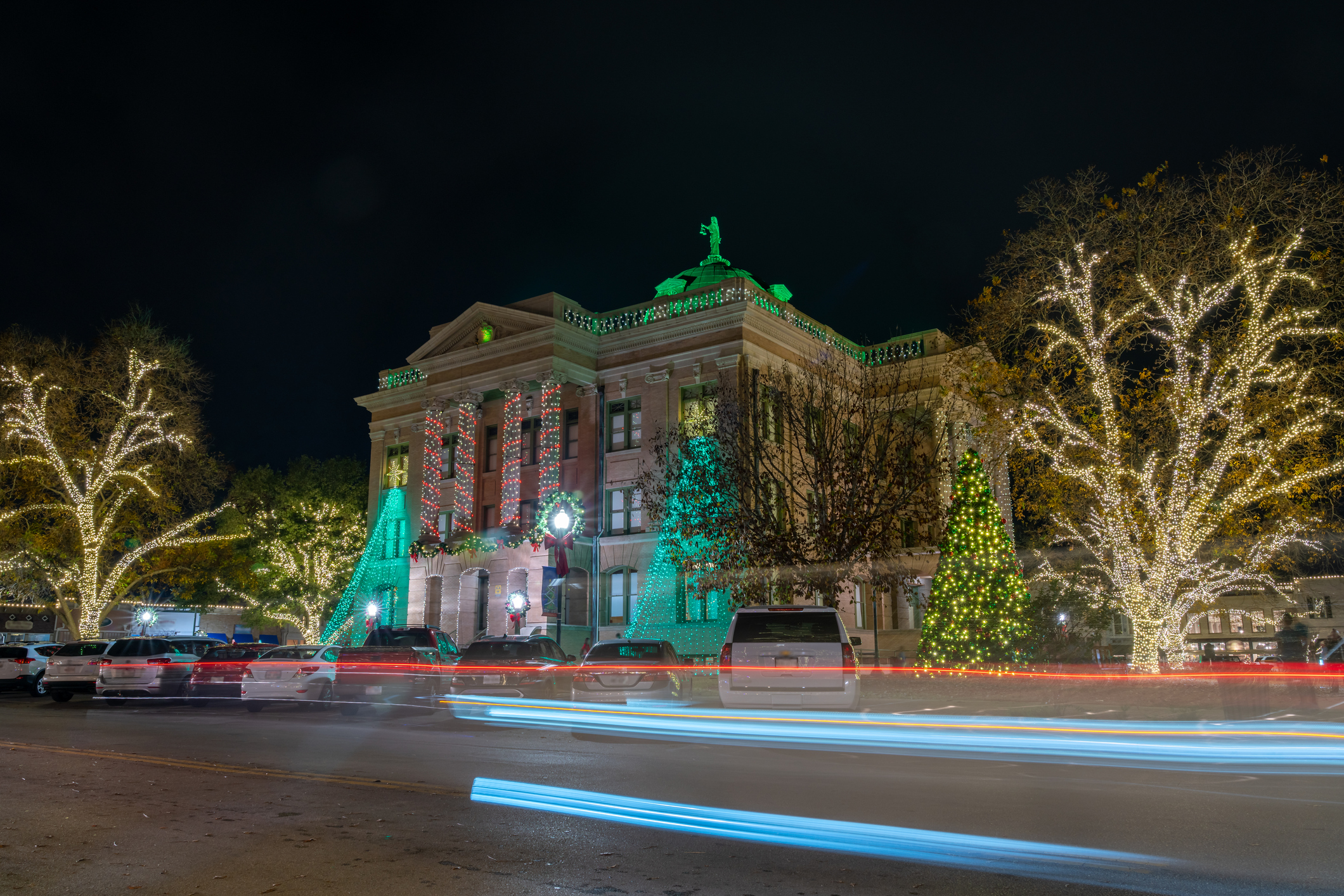 View of Georgetown downtown square lit up with colorful holiday lights for the annual Christmas Stroll View of Georgetown downtown square lit up with colorful holiday lights for the annual Christmas Stroll
