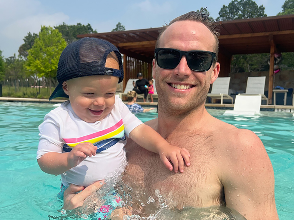 Photo of father and young daughter at the resort style pool amenity at Wolf Ranch Photo of father and young daughter at the resort style pool amenity at Wolf Ranch