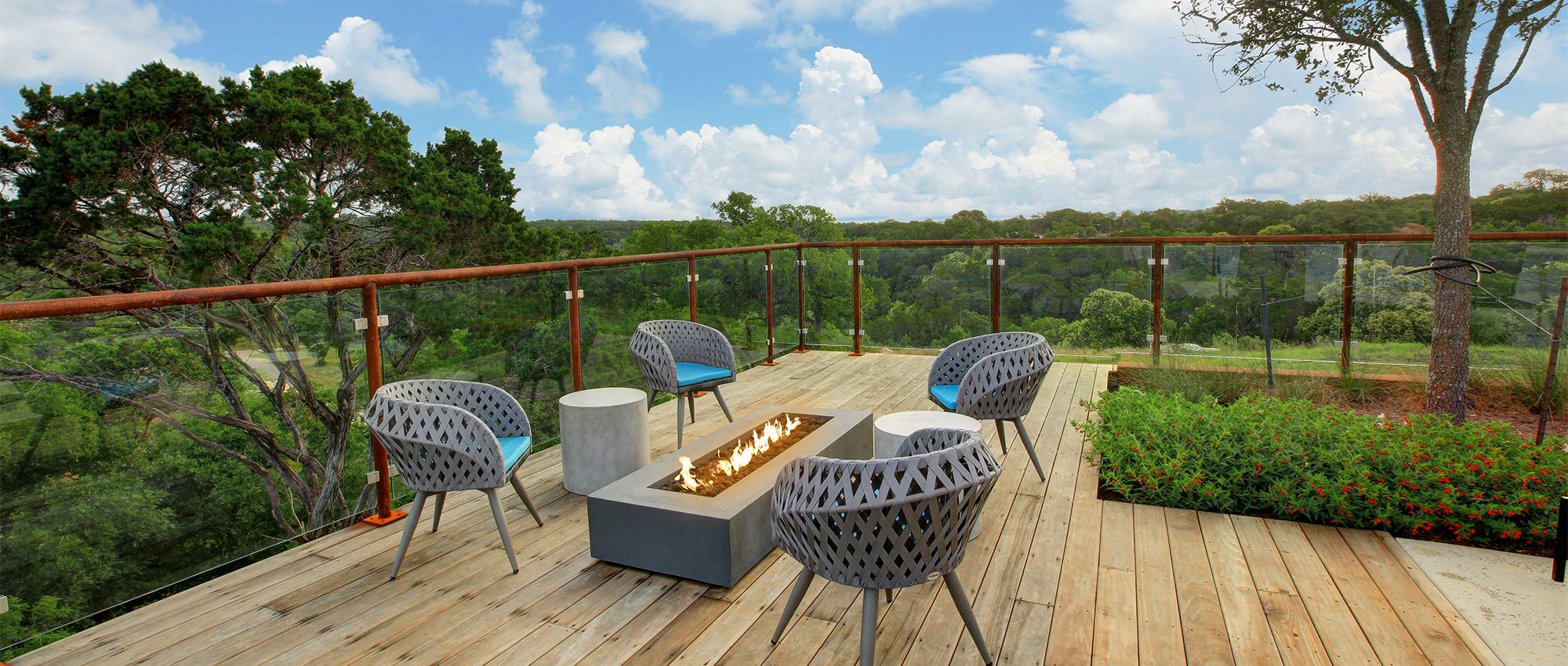Outdoor patio area with fire pit and view of San Gabriel river at Wolf Ranch South Fork amenity center Outdoor patio area with fire pit and view of San Gabriel river at Wolf Ranch South Fork amenity center